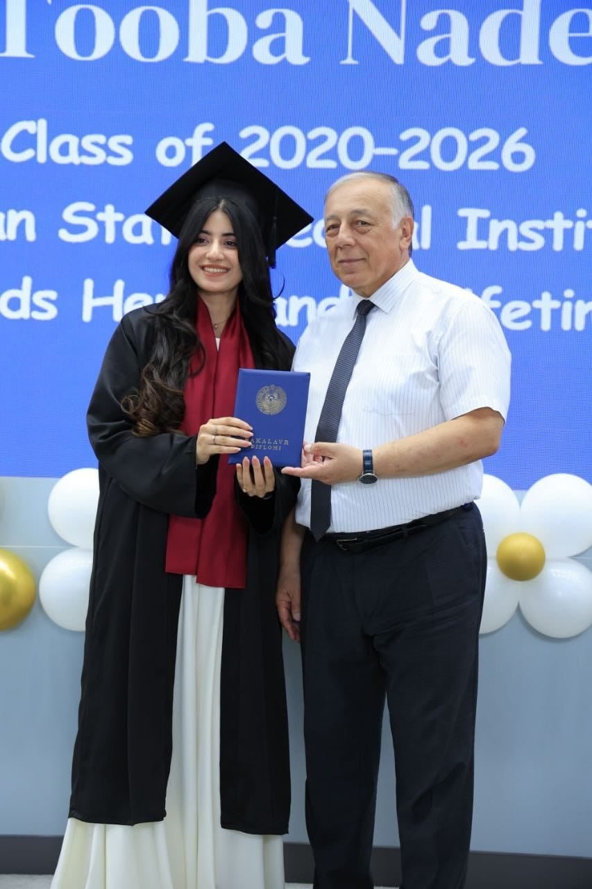 Graduate receiving her degree certificate at Andijan State Medical Institute